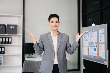 Young attractive businessman office worker business suits smiling at camera in office