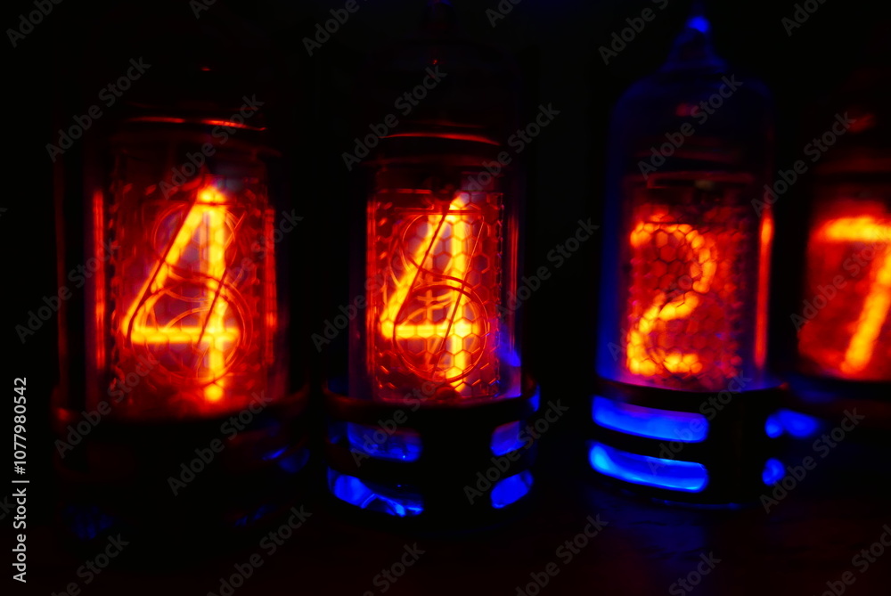 Fototapete retro nixie lamp indicator clock on dark background. the nixie tube indicator of the numbers of retr