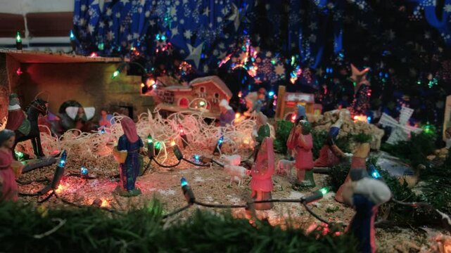 Camera Pan Over Nativity Scene in Spanish House on Christmas Eve with Joseph, Mary, Baby Jesus, Three Wise Men, and Starry Night Background