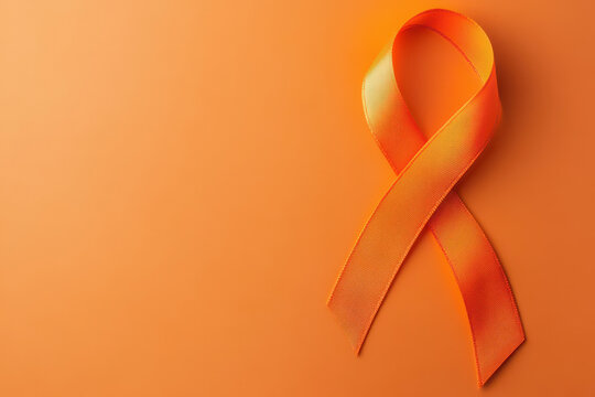 World Multiple Sclerosis Day. Horizontal banner. Copy space. Orange ribbon on a orange background for leukemia, kidney cancer, multiple sclerosis RSD awareness - Powered by Adobe