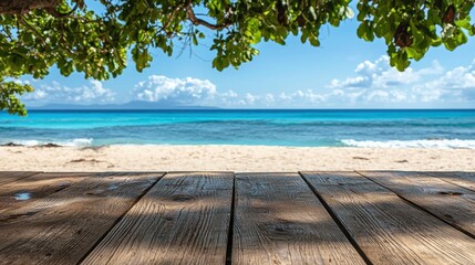 Fototapeta premium Serene Coastal View from Wooden Deck Overlooking Turquoise Waters and Sandy Beach with Lush Greenery and Clear Blue Skies