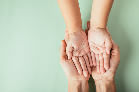 Celebrating Family Day, Top view of parents and kid holding empty hands. Embracing togetherness support and generational heritage.