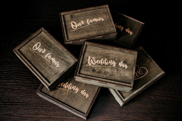 wooden wedding photo box on dark background