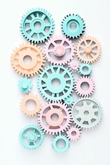 Pastel-colored gears interlock on a white background.