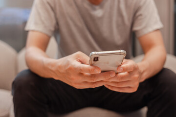 Social media and digital online concept, man using smart phone. The concept of living on vacation and playing social media. Social Distancing ,Working From Home