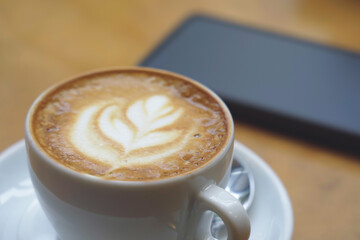 Close-up of a cappuccino coffee on a table in a cafe