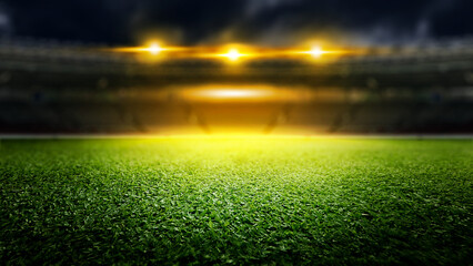 Naklejka premium Empty football stadium with green field and blur spotlights. The field is ready for a game