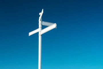 Blank white road signs on pointing in different directions.