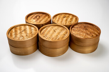 Set of chinese dim sum dumpling bamboo bowl basket isolated over white background