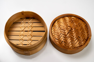 Chinese dim sum dumpling bamboo bowl basket isolated over white background
