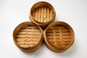 Set of chinese dim sum dumpling bamboo bowl basket isolated over white background