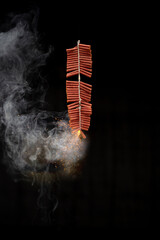 Red fire crackers string exploding with smokes background
