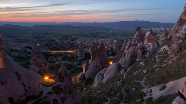 Uchisar Castle against dusk sky at sunset in Uchisar town inNevsehir Province in Cappadocia, Turkey