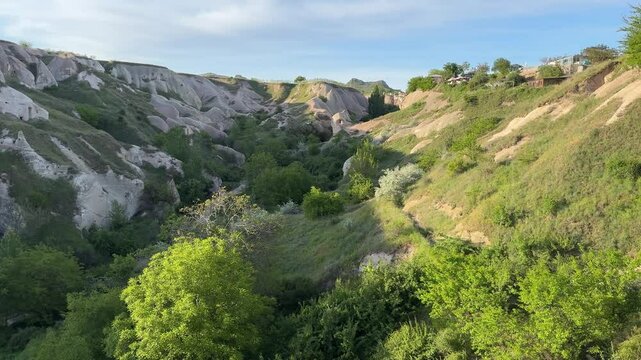 Rock caves in Uchisar town on a sunny day in Nevsehir Province in Cappadocia, Turkey