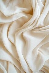 Fototapeta premium Soft, flowing, ivory fabric drapes.