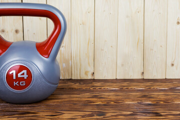 A kettlebell featuring the number 14 prominently displayed on it