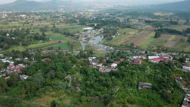 DRONE: URANDEN ISLAND AT NOON NEAR PATZCUARO
