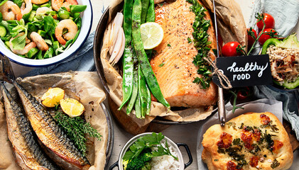 Assorted healthy seafood on plates for dinner or lunch.  traditional mediterranean cuisine