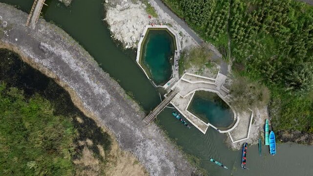 TOP DOWN VIEW OF URANDEN ISLAND WATER SPRINGS AT SUNSET NEAR PATZCUARO LAKE