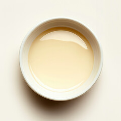White bowl with a clear liquid in it