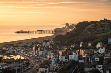 Sunset over Hastings old town from the top of east Hill east Sussex south east England UK