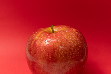 red apple with water drops