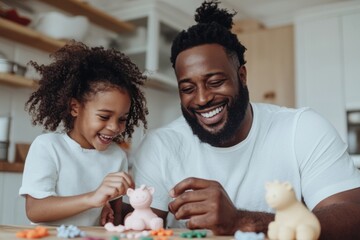 Happy father and daughter playing with clay at home