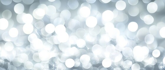 A blurry image of white circles with a silver background