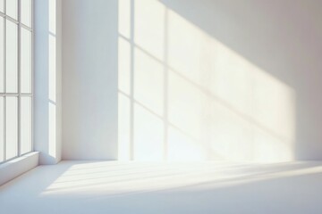 Fototapeta premium Sunlight streaming through a window in a white room.