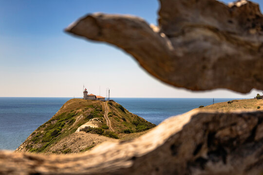 Cape emine lighthouse framed in a wooden frame.