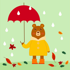 Bear in autumn. A bear in a yellow jacket stands in the autumn rain with a red umbrella.