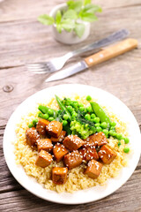 grilled tofu and sesam with bulgur and green pea. Vegan or vegetarian dish