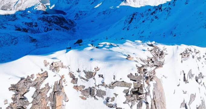Aerial view of  snow mountain summit in the winter sunny day at Sichuan China Dagu glacier