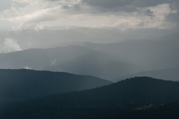 depressive mountains in rain clouds