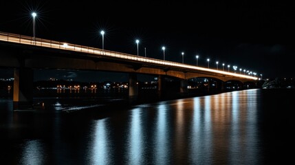 Nighttime Bridge with Reflections on River Water