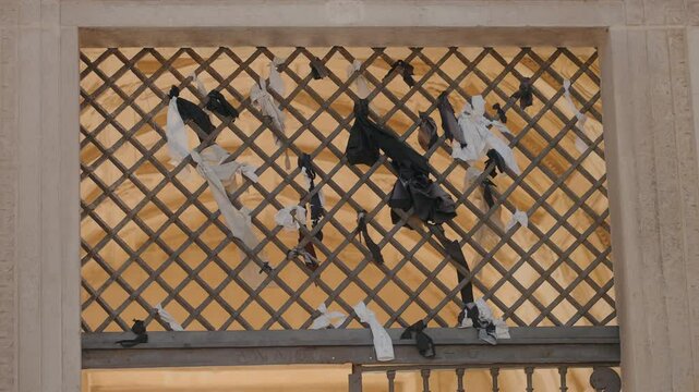 Ribbons tied on Coimbra University entrance gate, symbolizing student farewell tradition