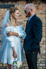 Couple, hug and portrait in outdoor wedding, commitment and promise of loyalty in marriage. People, embrace and celebrate in nature for relationship, support and love for partnership or romance union