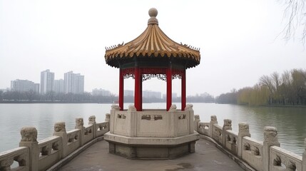 Fototapeta premium A traditional Chinese pavilion stands on a stone platform in the middle of a lake, surrounded