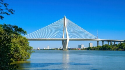 Obraz premium Modern Bridge Over Calm Water in Bright Blue Sky