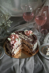a chocolate cake with pink flowers on top of it