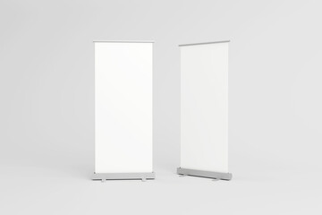 Empty white roll-up banners for presentations and exhibitions.