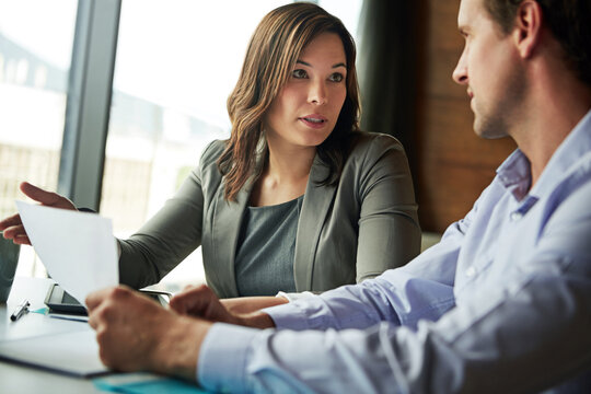 Business, employees and meeting with legal document at office for explaining contract with terms and conditions. Corporate, people and discussion at workplace with paperwork, advice and agreement