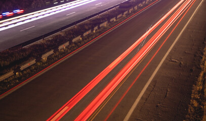 Highway car light trails at night.