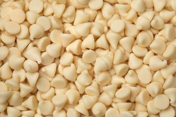 White chocolate chips close up full frame as background