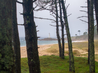 Fototapeta premium Faro y praia do Lago en Muxia Galicia