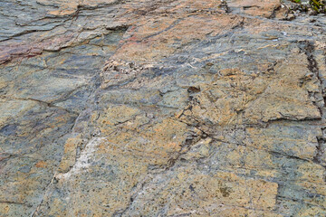Weathered mountain rock texture - colorful stone background