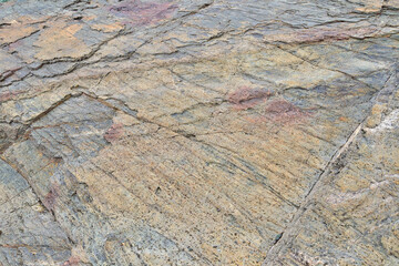 Weathered mountain rock texture - colorful stone background