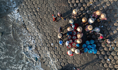 Dawn at Phuoc The fishing port, Binh Thuan, when the fishing boats return to the wharf, the fishing...