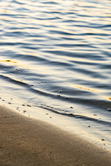 Evening waves on the seashore, sunset, closeup, summer vibes, relaxation, calmness 