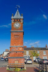 The clock tower in the town marketplace on a sunny autumn day in Wainfleet all saints. Lincolnshire UK